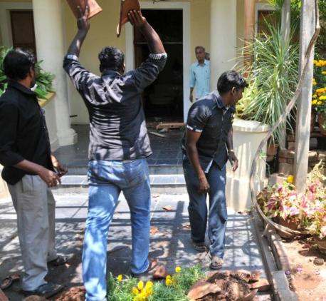 Members of the Periyar Dravidar Kazhagam damage flower pots in the Sri Aurobindo Ashram in Puducherry on Thursday. Photo: T. Singaravelou. Photo Courtesy: The Hindu. 